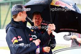 (L to R): Daniil Kvyat (RUS) Scuderia Toro Rosso and Sebastian Vettel (GER) Red Bull Racing on the drivers parade. 05.10.2014. Formula 1 World Championship, Rd 15, Japanese Grand Prix, Suzuka, Japan, Race Day.