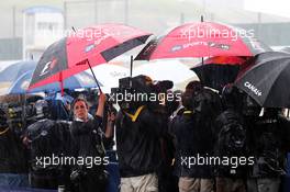 The media in a wet and rainy paddock. 02.10.2014. Formula 1 World Championship, Rd 15, Japanese Grand Prix, Suzuka, Japan, Preparation Day.