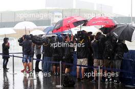 The media in a wet and rainy paddock. 02.10.2014. Formula 1 World Championship, Rd 15, Japanese Grand Prix, Suzuka, Japan, Preparation Day.