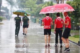 Max Chilton (GBR) Marussia F1 Team in a wet and rainy paddock. 28.03.2014. Formula 1 World Championship, Rd 2, Malaysian Grand Prix, Sepang, Malaysia, Friday.