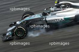 Nico Rosberg (GER) Mercedes AMG F1 W05 locks up under braking. 28.03.2014. Formula 1 World Championship, Rd 2, Malaysian Grand Prix, Sepang, Malaysia, Friday.