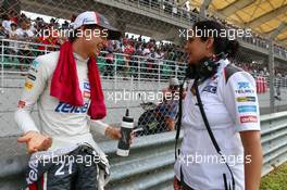 (L to R): Esteban Gutierrez (MEX) Sauber with Monisha Kaltenborn (AUT) Sauber Team Principal on the grid. 30.03.2014. Formula 1 World Championship, Rd 2, Malaysian Grand Prix, Sepang, Malaysia, Sunday.
