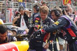 Sebastian Vettel (GER) Red Bull Racing RB10 on the grid. 30.03.2014. Formula 1 World Championship, Rd 2, Malaysian Grand Prix, Sepang, Malaysia, Sunday.