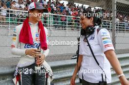 (L to R): Esteban Gutierrez (MEX) Sauber with Monisha Kaltenborn (AUT) Sauber Team Principal on the grid. 30.03.2014. Formula 1 World Championship, Rd 2, Malaysian Grand Prix, Sepang, Malaysia, Sunday.