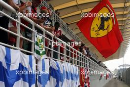 Ferrari fan and flag in the grandstand. 30.03.2014. Formula 1 World Championship, Rd 2, Malaysian Grand Prix, Sepang, Malaysia, Sunday.