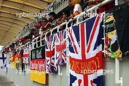Flags and banners in the grandstand. 30.03.2014. Formula 1 World Championship, Rd 2, Malaysian Grand Prix, Sepang, Malaysia, Sunday.