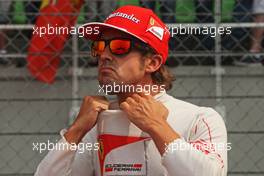Fernando Alonso (ESP) Ferrari on the grid. 30.03.2014. Formula 1 World Championship, Rd 2, Malaysian Grand Prix, Sepang, Malaysia, Sunday.