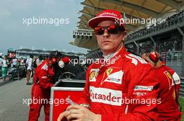 Kimi Raikkonen (FIN) Ferrari on the grid. 30.03.2014. Formula 1 World Championship, Rd 2, Malaysian Grand Prix, Sepang, Malaysia, Sunday.