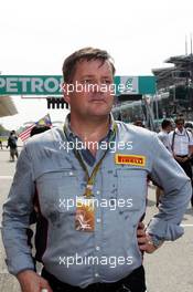 Paul Hembery (GBR) Pirelli Motorsport Director on the grid. 30.03.2014. Formula 1 World Championship, Rd 2, Malaysian Grand Prix, Sepang, Malaysia, Sunday.