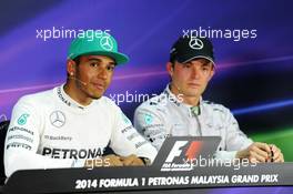 The FIA Press Conference (L to R): race winner Lewis Hamilton (GBR) Mercedes AMG F1 with team mate Nico Rosberg (GER) Mercedes AMG F1. 30.03.2014. Formula 1 World Championship, Rd 2, Malaysian Grand Prix, Sepang, Malaysia, Sunday.