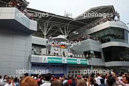 The podium (L to R): Nico Rosberg (GER) Mercedes AMG F1, second; Lewis Hamilton (GBR) Mercedes AMG F1, race winner; Sebastian Vettel (GER) Red Bull Racing, third. 30.03.2014. Formula 1 World Championship, Rd 2, Malaysian Grand Prix, Sepang, Malaysia, Sunday.