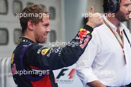 Sebastian Vettel (GER) Red Bull Racing celebrates his third position in parc ferme. 30.03.2014. Formula 1 World Championship, Rd 2, Malaysian Grand Prix, Sepang, Malaysia, Sunday.
