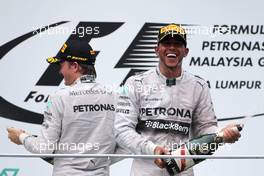 Lewis Hamilton (GBR), Mercedes AMG F1 Team and Nico Rosberg (GER), Mercedes AMG F1 Team  30.03.2014. Formula 1 World Championship, Rd 2, Malaysian Grand Prix, Sepang, Malaysia, Sunday.