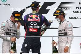 Nico Rosberg (GER), Mercedes AMG F1 Team, Lewis Hamilton (GBR), Mercedes AMG F1 Team and Sebastian Vettel (GER), Red Bull Racing  30.03.2014. Formula 1 World Championship, Rd 2, Malaysian Grand Prix, Sepang, Malaysia, Sunday.