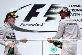 Nico Rosberg (GER), Mercedes AMG F1 Team and Lewis Hamilton (GBR), Mercedes AMG F1 Team  30.03.2014. Formula 1 World Championship, Rd 2, Malaysian Grand Prix, Sepang, Malaysia, Sunday.