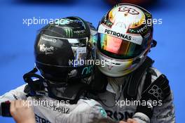 Nico Rosberg (GER) Mercedes AMG F1 and Lewis Hamilton (GBR) Mercedes AMG F1  30.03.2014. Formula 1 World Championship, Rd 2, Malaysian Grand Prix, Sepang, Malaysia, Sunday.