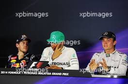 The post race FIA Press Conference (L to R): Sebastian Vettel (GER) Red Bull Racing, third; Lewis Hamilton (GBR) Mercedes AMG F1, race winner; Nico Rosberg (GER) Mercedes AMG F1, seond. 30.03.2014. Formula 1 World Championship, Rd 2, Malaysian Grand Prix, Sepang, Malaysia, Sunday.
