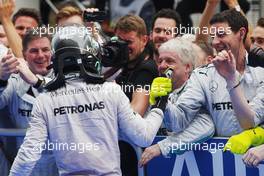 Nico Rosberg (GER) Mercedes AMG F1 celebrates his second position with the team in parc ferme. 30.03.2014. Formula 1 World Championship, Rd 2, Malaysian Grand Prix, Sepang, Malaysia, Sunday.
