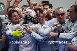 Race winner Lewis Hamilton (GBR) Mercedes AMG F1 celebrates with the team in parc ferme. 30.03.2014. Formula 1 World Championship, Rd 2, Malaysian Grand Prix, Sepang, Malaysia, Sunday.