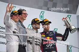 The podium (L to R): Nico Rosberg (GER) Mercedes AMG F1, second; Andrew Shovlin (GBR) Mercedes AMG F1 Engineer; Lewis Hamilton (GBR) Mercedes AMG F1, race winner; Sebastian Vettel (GER) Red Bull Racing, third. 30.03.2014. Formula 1 World Championship, Rd 2, Malaysian Grand Prix, Sepang, Malaysia, Sunday.