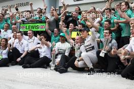 Race winner Lewis Hamilton (GBR) Mercedes AMG F1 and second placed team mate Nico Rosberg (GER) Mercedes AMG F1 celebrate with the team. 30.03.2014. Formula 1 World Championship, Rd 2, Malaysian Grand Prix, Sepang, Malaysia, Sunday.