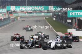 Valtteri Bottas (FIN) Williams FW36 and Esteban Gutierrez (MEX) Sauber C33. 30.03.2014. Formula 1 World Championship, Rd 2, Malaysian Grand Prix, Sepang, Malaysia, Sunday.