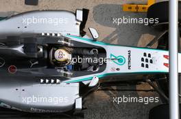 Lewis Hamilton (GBR) Mercedes AMG F1 W05 pit stop. 30.03.2014. Formula 1 World Championship, Rd 2, Malaysian Grand Prix, Sepang, Malaysia, Sunday.
