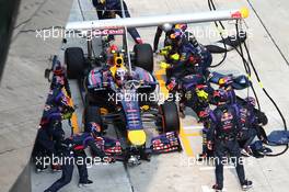 Daniel Ricciardo (AUS) Red Bull Racing RB10  pit stop. 30.03.2014. Formula 1 World Championship, Rd 2, Malaysian Grand Prix, Sepang, Malaysia, Sunday.