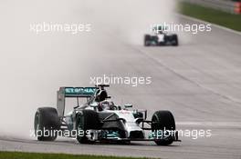 Lewis Hamilton (GBR) Mercedes AMG F1 W05 leads team mate Nico Rosberg (GER) Mercedes AMG F1 W05. 29.03.2014. Formula 1 World Championship, Rd 2, Malaysian Grand Prix, Sepang, Malaysia, Saturday.