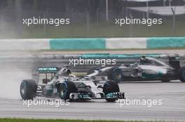 Lewis Hamilton (GBR) Mercedes AMG F1 W05 leads team mate Nico Rosberg (GER) Mercedes AMG F1 W05. 29.03.2014. Formula 1 World Championship, Rd 2, Malaysian Grand Prix, Sepang, Malaysia, Saturday.