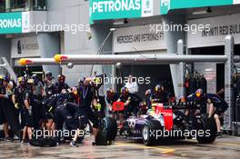 Sebastian Vettel (GER) Red Bull Racing RB10 makes a pit stop. 29.03.2014. Formula 1 World Championship, Rd 2, Malaysian Grand Prix, Sepang, Malaysia, Saturday.