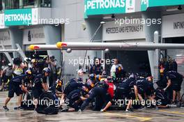 Daniel Ricciardo (AUS) Red Bull Racing RB10 makes a pit stop. 29.03.2014. Formula 1 World Championship, Rd 2, Malaysian Grand Prix, Sepang, Malaysia, Saturday.