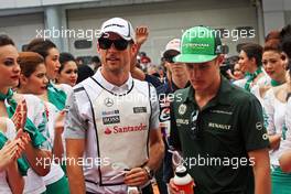 (L to R): Jenson Button (GBR) McLaren and Marcus Ericsson (SWE) Caterham on the drivers parade. 30.03.2014. Formula 1 World Championship, Rd 2, Malaysian Grand Prix, Sepang, Malaysia, Sunday.