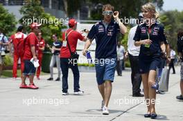 Sebastian Vettel (GER) Red Bull Racing with Britta Roeske (AUT) Red Bull Racing Press Officer. 30.03.2014. Formula 1 World Championship, Rd 2, Malaysian Grand Prix, Sepang, Malaysia, Sunday.