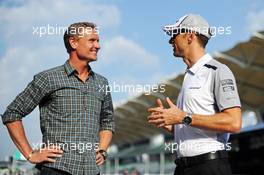 (L to R): David Coulthard (GBR) Red Bull Racing and Scuderia Toro Advisor / BBC Television Commentator with Jenson Button (GBR) McLaren. 27.03.2014. Formula 1 World Championship, Rd 2, Malaysian Grand Prix, Sepang, Malaysia, Thursday.