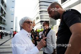 (L to R): Bernie Ecclestone (GBR) with Gerard Lopez (FRA) Lotus F1 Team Principal. 12.10.2014. Formula 1 World Championship, Rd 16, Russian Grand Prix, Sochi Autodrom, Sochi, Russia, Race Day.