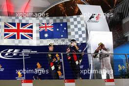 Race winner Lewis Hamilton (GBR) Mercedes AMG F1 (Right) (Centre); on the podium with Daniel Ricciardo (AUS) Red Bull Racing (Left) and Sebastian Vettel (GER) Red Bull Racing (Centre). 21.09.2014. Formula 1 World Championship, Rd 14, Singapore Grand Prix, Singapore, Singapore, Race Day.