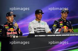 The post race FIA Press Conference (L to R): Sebastian Vettel (GER) Red Bull Racing, second; Lewis Hamilton (GBR) Mercedes AMG F1, race winner; Daniel Ricciardo (AUS) Red Bull Racing, third. 21.09.2014. Formula 1 World Championship, Rd 14, Singapore Grand Prix, Singapore, Singapore, Race Day.