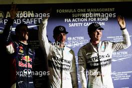 Qualifying top three in parc ferme (L to R): Daniel Ricciardo (AUS) Red Bull Racing, third; Lewis Hamilton (GBR) Mercedes AMG F1, pole position; Nico Rosberg (GER) Mercedes AMG F1, second. 20.09.2014. Formula 1 World Championship, Rd 14, Singapore Grand Prix, Singapore, Singapore, Qualifying Day.