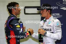(L to R): Third placed Daniel Ricciardo (AUS) Red Bull Racing with second placed Nico Rosberg (GER) Mercedes AMG F1 in qualifying parc ferme. 20.09.2014. Formula 1 World Championship, Rd 14, Singapore Grand Prix, Singapore, Singapore, Qualifying Day.
