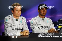 The post qualifying FIA Press Conference (L to R): Nico Rosberg (GER) Mercedes AMG F1, second; Lewis Hamilton (GBR) Mercedes AMG F1, pole position. 20.09.2014. Formula 1 World Championship, Rd 14, Singapore Grand Prix, Singapore, Singapore, Qualifying Day.