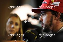 Fernando Alonso (ESP) Ferrari with the media. 20.09.2014. Formula 1 World Championship, Rd 14, Singapore Grand Prix, Singapore, Singapore, Qualifying Day.