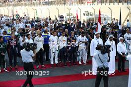 The drivers observe the anthem on the grid. 23.11.2014. Formula 1 World Championship, Rd 19, Abu Dhabi Grand Prix, Yas Marina Circuit, Abu Dhabi, Race Day.