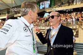 (L to R): Thomas Weber (GER) Member of the Board of Management of Daimler AG with Donald Mackenzie (GBR) CVC Capital Partners Managing Partner, Co Head of Global Investments on the grid. 23.11.2014. Formula 1 World Championship, Rd 19, Abu Dhabi Grand Prix, Yas Marina Circuit, Abu Dhabi, Race Day.