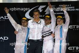 The podium (L to R): Felipe Massa (BRA) Williams, second; Toto Wolff (GER) Mercedes AMG F1 Shareholder and Executive Director; Lewis Hamilton (GBR) Mercedes AMG F1, race winner and World Champion; Valtteri Bottas (FIN) Williams, third. 23.11.2014. Formula 1 World Championship, Rd 19, Abu Dhabi Grand Prix, Yas Marina Circuit, Abu Dhabi, Race Day.
