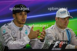 (L to R): Race winner and World Champion Lewis Hamilton (GBR) Mercedes AMG F1 with Valtteri Bottas (FIN) Williams in the FIA Press Conference. 23.11.2014. Formula 1 World Championship, Rd 19, Abu Dhabi Grand Prix, Yas Marina Circuit, Abu Dhabi, Race Day.