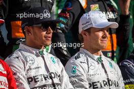 (L to R): Lewis Hamilton (GBR) Mercedes AMG F1 and Nico Rosberg (GER) Mercedes AMG F1 at the end of season photograph. 23.11.2014. Formula 1 World Championship, Rd 19, Abu Dhabi Grand Prix, Yas Marina Circuit, Abu Dhabi, Race Day.