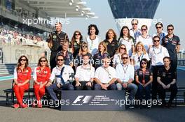 The Press Officers' Group Photograph. 23.11.2014. Formula 1 World Championship, Rd 19, Abu Dhabi Grand Prix, Yas Marina Circuit, Abu Dhabi, Race Day.