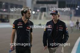 (L to R): Jean-Eric Vergne (FRA) Scuderia Toro Rosso walks the circuit with Max Verstappen (NLD) Scuderia Toro Rosso Test Driver. 20.11.2014. Formula 1 World Championship, Rd 19, Abu Dhabi Grand Prix, Yas Marina Circuit, Abu Dhabi, Preparation Day.