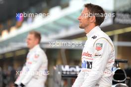 (L to R): Kevin Magnussen (DEN) McLaren and Jenson Button (GBR) McLaren at a team photograph. 20.11.2014. Formula 1 World Championship, Rd 19, Abu Dhabi Grand Prix, Yas Marina Circuit, Abu Dhabi, Preparation Day.